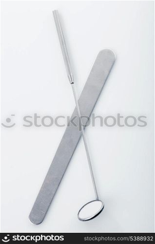 Medical instruments for ENT doctor: mirror and scapula for throat. Diagnostic concept