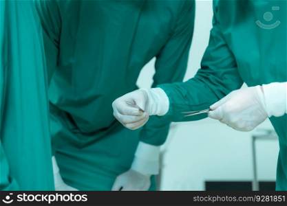 Medical lecturer in cardiology and medical team in the heart transplantation room A knife is being used for surgery on a patient.