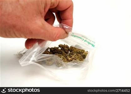 Medical Marijuana. A small plastic bag labeled medical Cannabis with dried buds of Marijuana inside used by some to treat a wide range of medical conditions