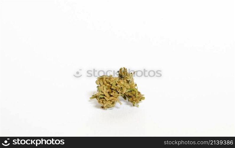 medical marijuana buds, already ripe and ready for consumption, isolated in front of a white background