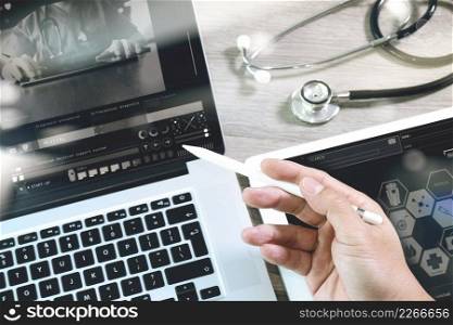Medical network technology concept. Doctor hand working with stethoscope and laptop computer digital tablet with medical chart interface. View from top and close up photo. Double exposure effects, Minimalism