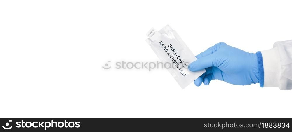 Medical personnel hand showing envelope of Covid-19 antigen rapid test kit on white background,Coronavirus infectious protect concept