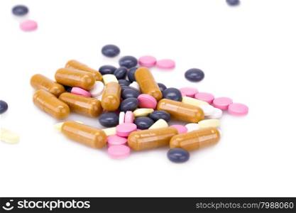 Medical pills and capsules isolated on white background.