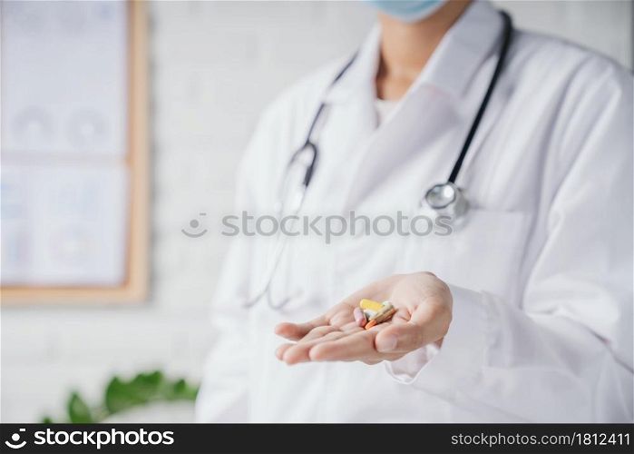 medical pills on doctor hand