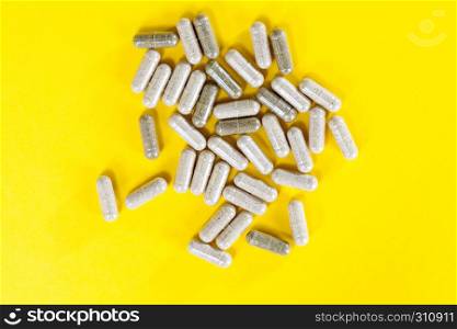 Medical pills with natural ingredients of herbs bark and other folk remedies, homeopathic medicine. Close-up pile