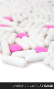 Medical Pink Pills and White Capsule On White Background