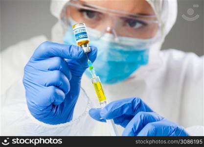 Medical scientist holding sample Coronavirus COVID-19 vaccine,injecting yellow liquid with syringe jab,global pandemic crisis,cure & treatment research,volunteer patients trial,research analysis hope