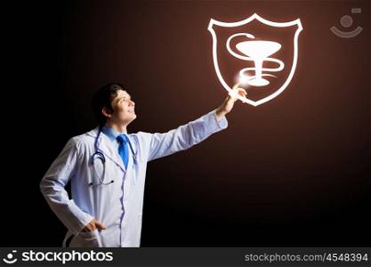 Medical sign. Young male doctor touching with finger media icon
