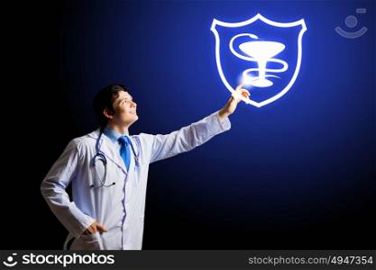 Medical sign. Young male doctor touching with finger media icon