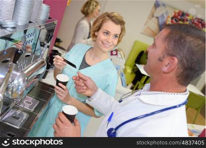 medical staff chatting in modern hospital canteen