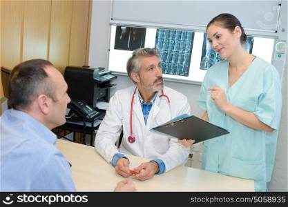 Medical staff giving results to patient