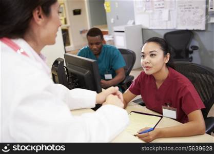 Medical Staff Meeting At Nurses Station