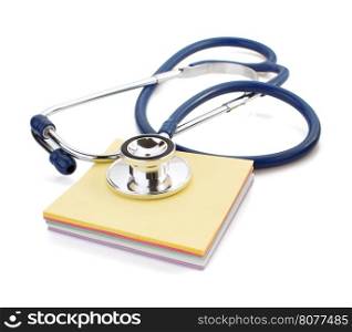 medical stethoscope and note paper on white background