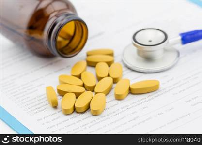medical stethoscope head with pile of pill closeup. care, health, protection, prevention and help. Healthy life or insurance concept. medical stethoscope head with pile of pill closeup. care, health