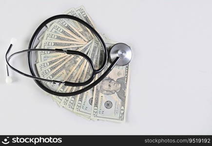 Medical stethoscope on twenty dollar bills isolated, medical health cost concept, stethoscope and money. Stethoscope on one dollar bills isolated with copy space