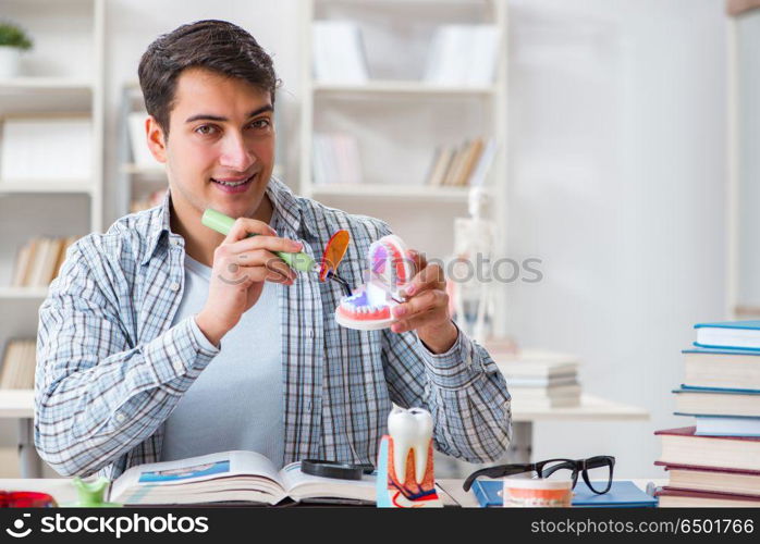 Medical student learning dentistry in classroom