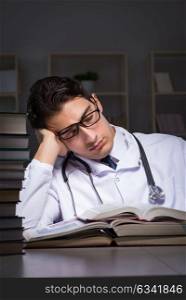 Medical student preparing for university exams at night