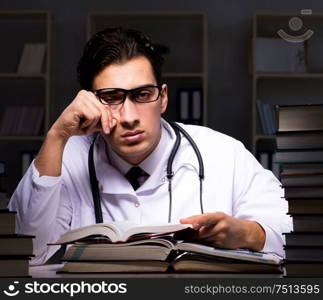 Medical student preparing for university exams at night. The medical student preparing for university exams at night