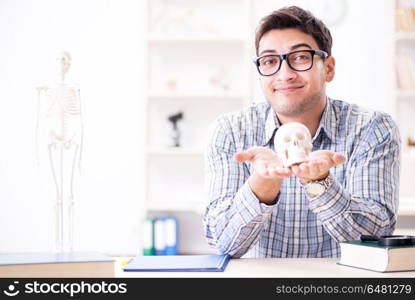 Medical student studing the skeleton