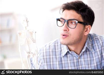 Medical student studing the skeleton