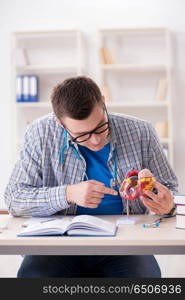 Medical student studying heart in classroom during lecture