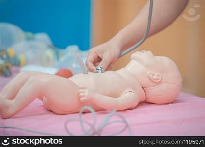 Medical students are training to save lives in the infant model.