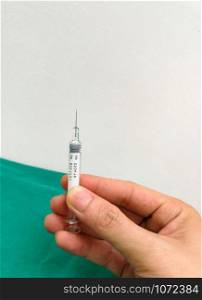 Medical syringe injection needle in hand / Equipment medical tool for nurse or doctor