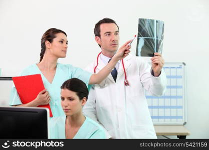 Medical team discussing an xray