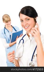Medical team doctor young nurse female smiling calling phone