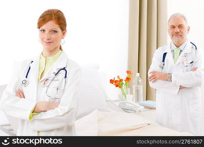 Medical team - portrait of two doctor with stethoscope in hospital