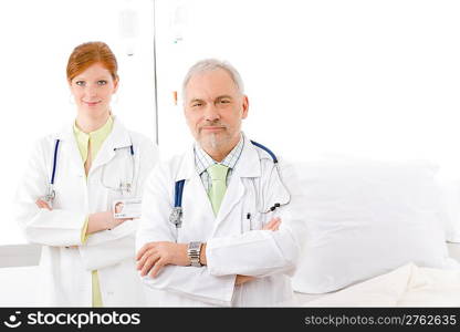 Medical team - portrait of two doctor with stethoscope in hospital