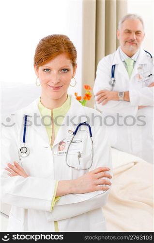 Medical team - portrait of two doctor with stethoscope in hospital