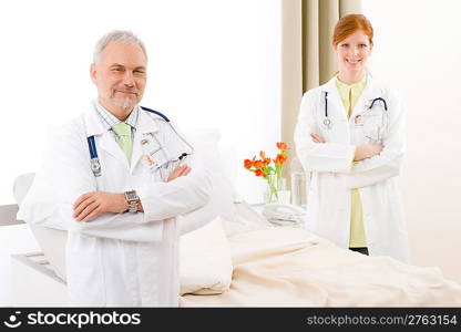 Medical team - portrait of two doctor with stethoscope in hospital