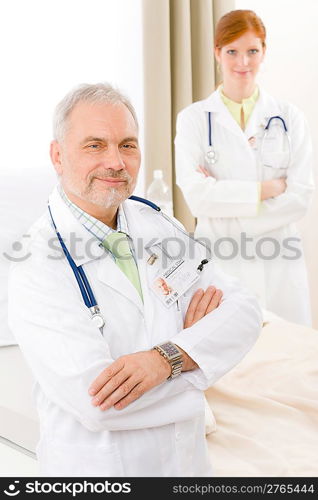 Medical team - portrait of two doctor with stethoscope in hospital