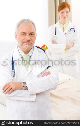 Medical team - portrait of two doctor with stethoscope in hospital