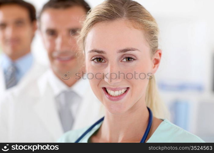 Medical team standing in clinic room