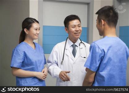 Medical Team Talking In Hospital