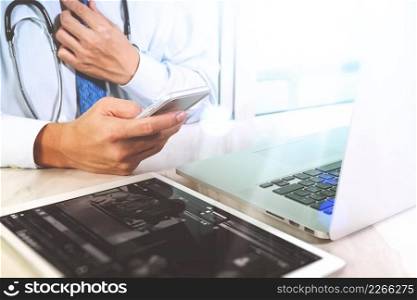 Medical technology concept. Doctor hand working with modern digital tablet and laptop computer with medical chart interface, Sun flare effect photo