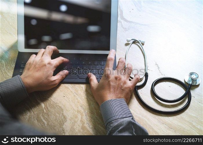 Medical technology concept. Doctor hand working with modern digital tablet dock screen computer with medical chart interface, Sun flare effect photo