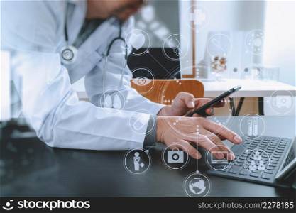Medical technology concept. Doctor working with smart phone and stethoscope and digital tablet computer in modern office at hospital with virtual digital graphic icons diagram