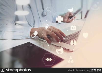 Medical technology concept. Doctor working with smart phone and stethoscope and digital tablet computer in modern office at hospital with computer interface icons diagram