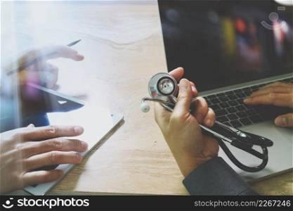 Medical technology network team concept. Doctor hand working with smart phone modern digital tablet and laptop computer with graphics  chart interface, Sun flare effect photo