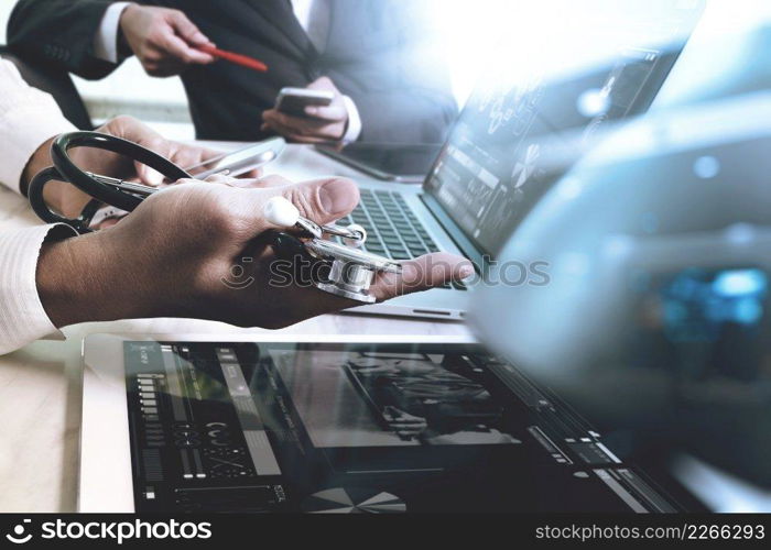 Medical technology network team meeting concept. Doctor hand working smart phone modern digital tablet laptop computer medical chart interface, double exposure effect photo