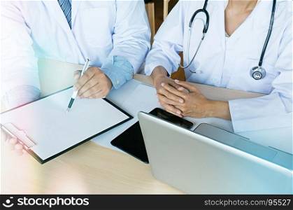 Medical technology network team meeting concept. Doctor hand working smart phone modern digital tablet laptop computer graphics chart interface.