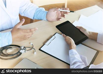 Medical technology network team meeting concept. Doctor hand working smart phone modern digital tablet laptop computer graphics chart interface.