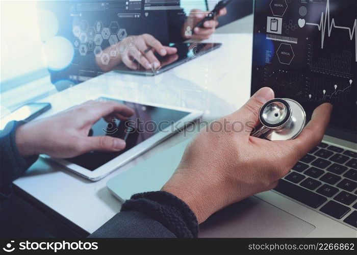 Medical technology≠twork team meeting concept. Doctor hand working smart pho≠modern digital tab≤t laptop computer graφcs chart∫erface, sun flare effect photo