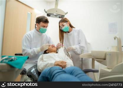 Medical treatment at the dentist office,Dentist examining a patient?s teeth,Teeth health concept.