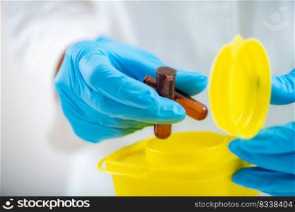Medical Waste. Throwing Away Laboratory Consumables in Container for Hazardous Medical Waste. . Medical Waste. Throwing Away Laboratory Consumables in Container for Hazardous Medical Waste.