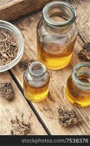 Medicinal tincture from the roots and rhizomes of valerian.Alternative medicine. Herbal tincture of valerian