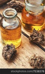 Medicinal tincture from the roots and rhizomes of valerian.Alternative medicine. Herbal tincture of valerian